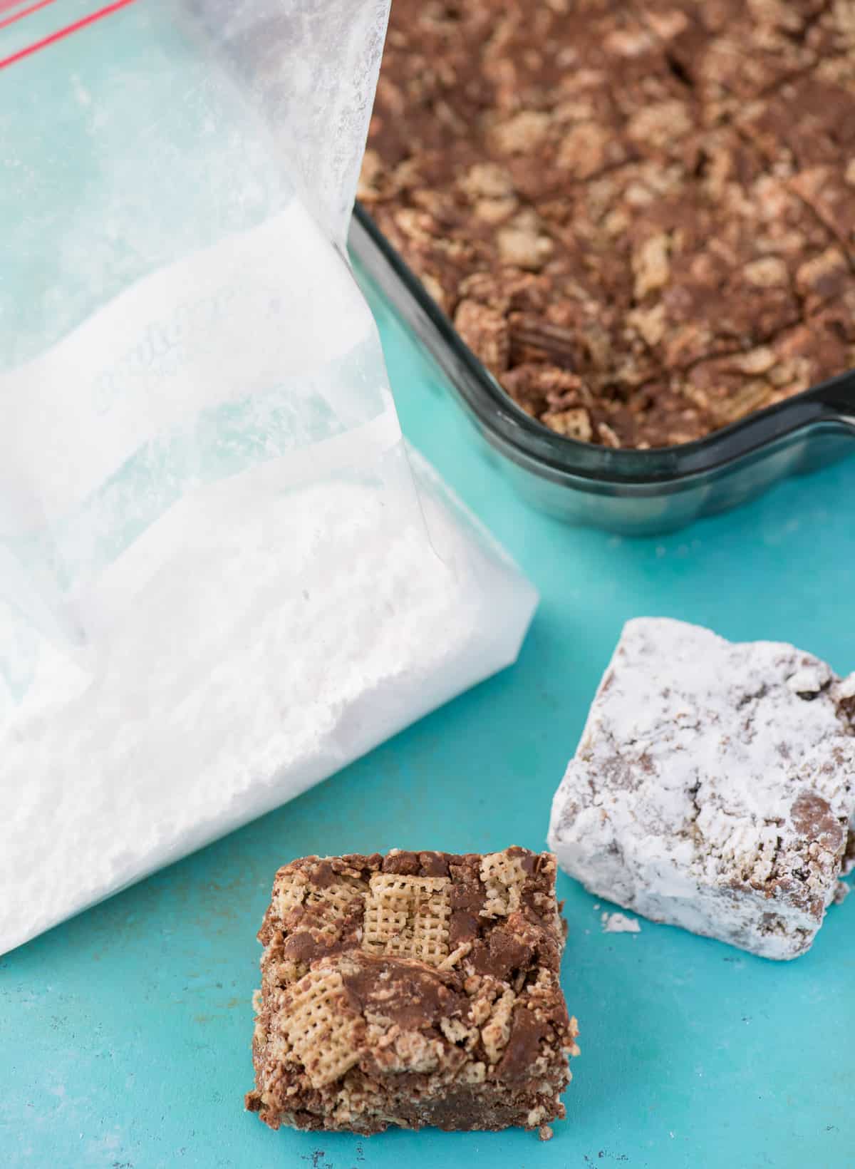 puppy chow bars with bag of powdered sugar 