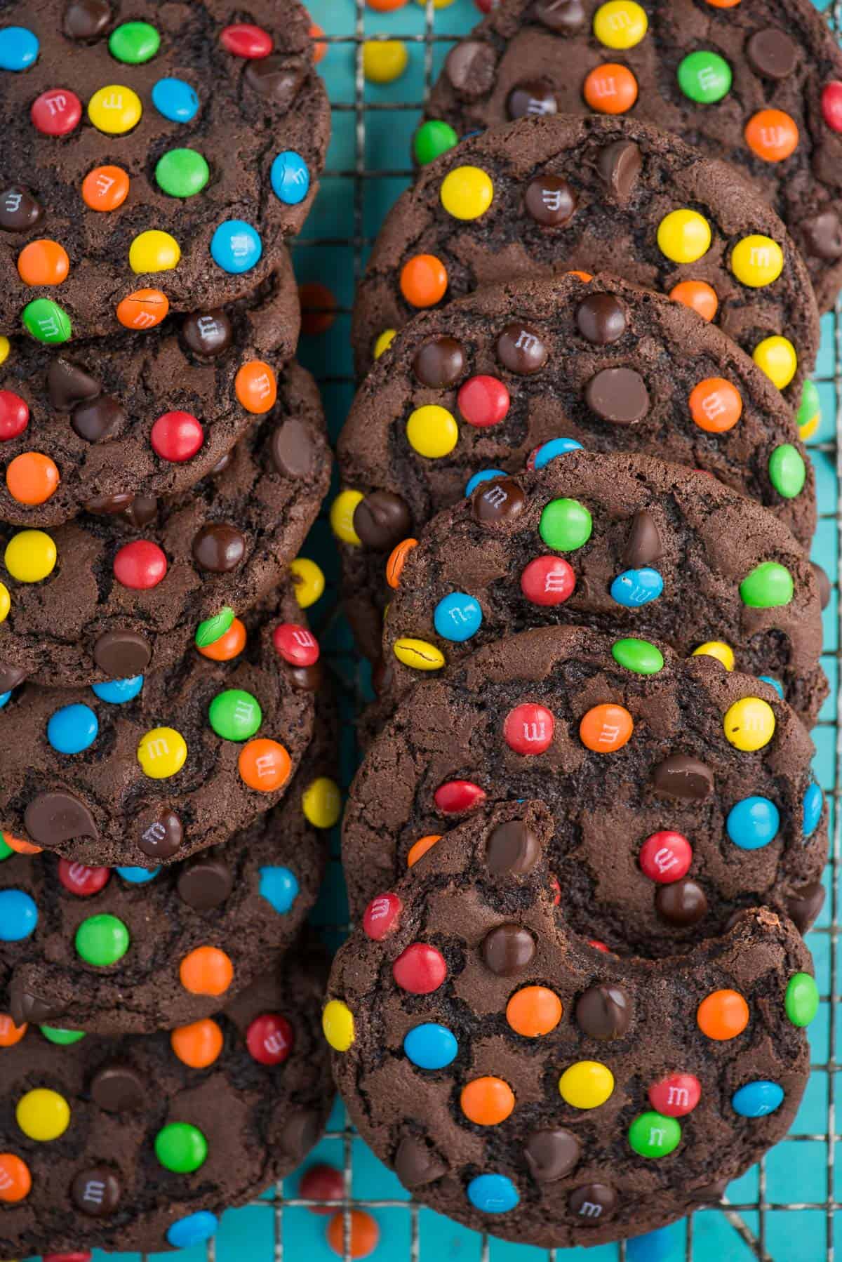 double chocolate chip cookies with m&ms and chocolate chips on cooling rack