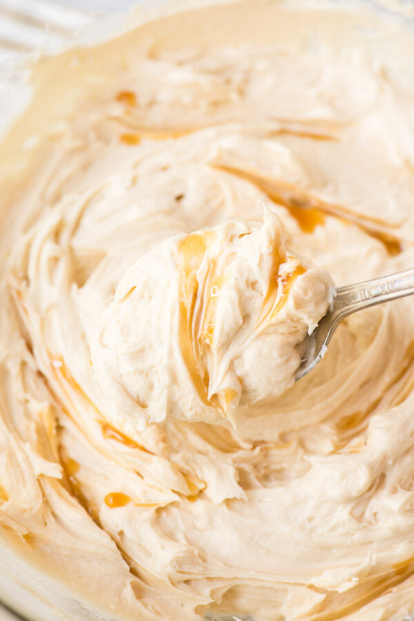 salted caramel frosting on metal spoon