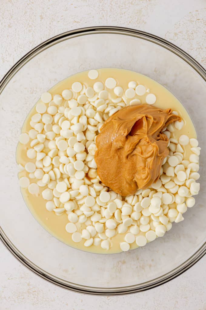 white chocolate chips, peanut butter and sweetened condensed milk in glass bowl
