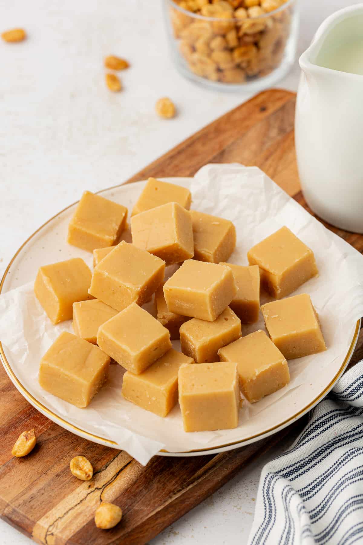 peanut butter fudge cut into small pieces displayed on a plate