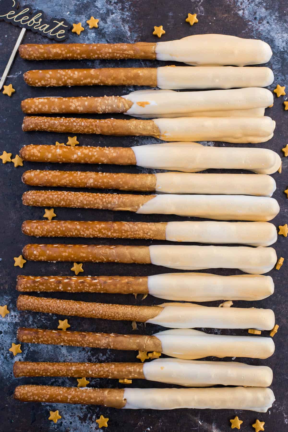 new year’s eve gold pretzels on dark background