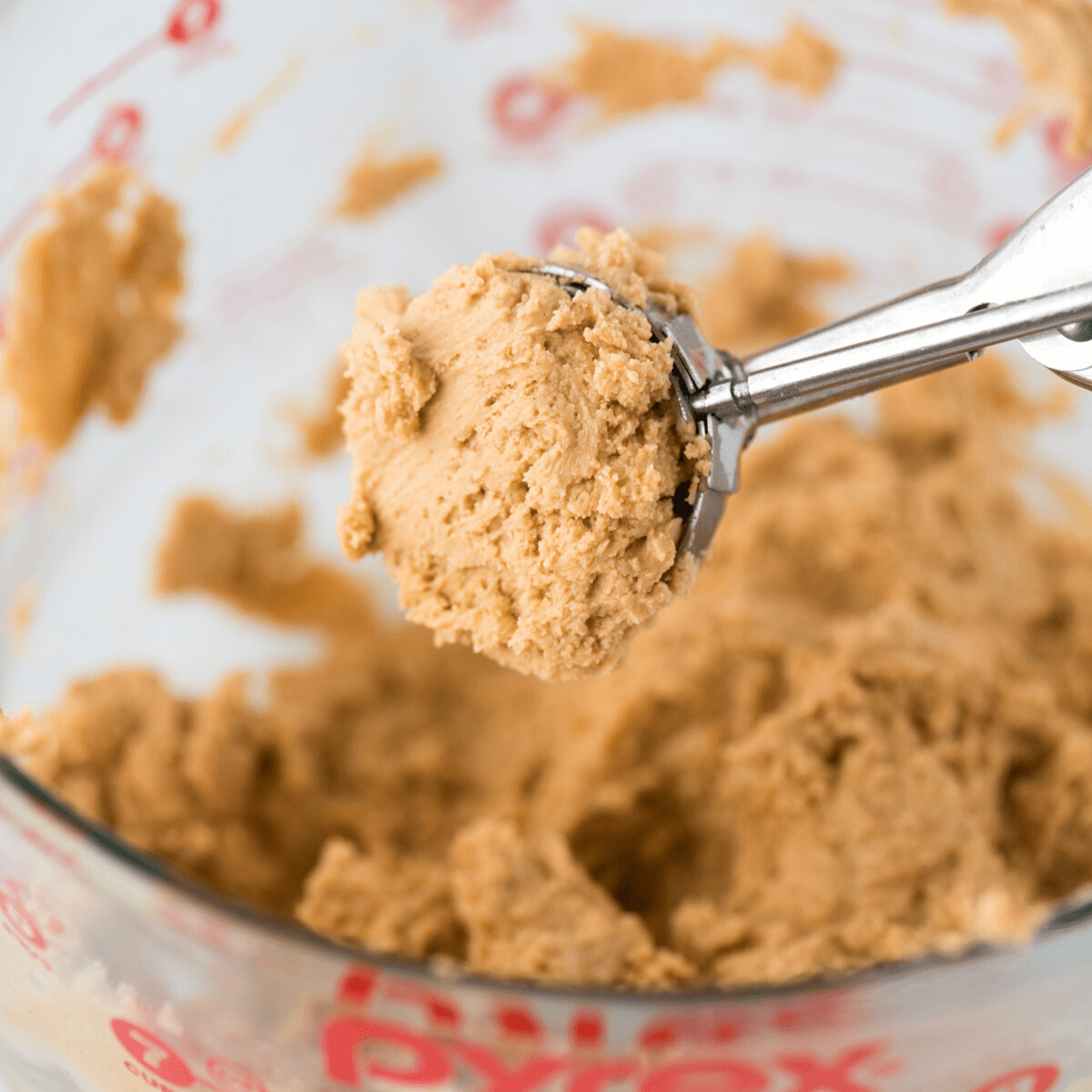 peanut butter ball mixture in cookie scoop