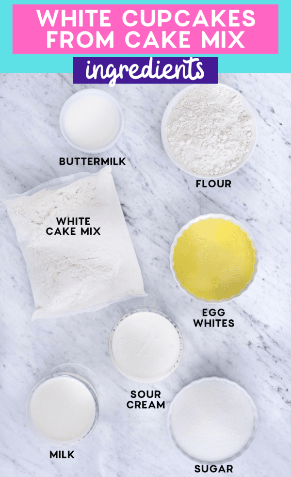 ingredients to make easy vanilla cupcakes on white marble background