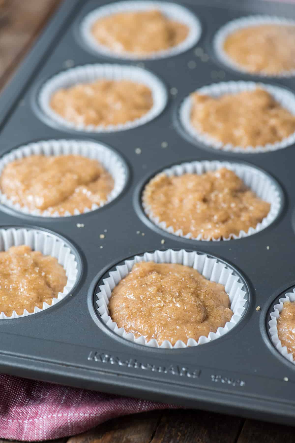 applesauce muffin batter in metal muffin pan