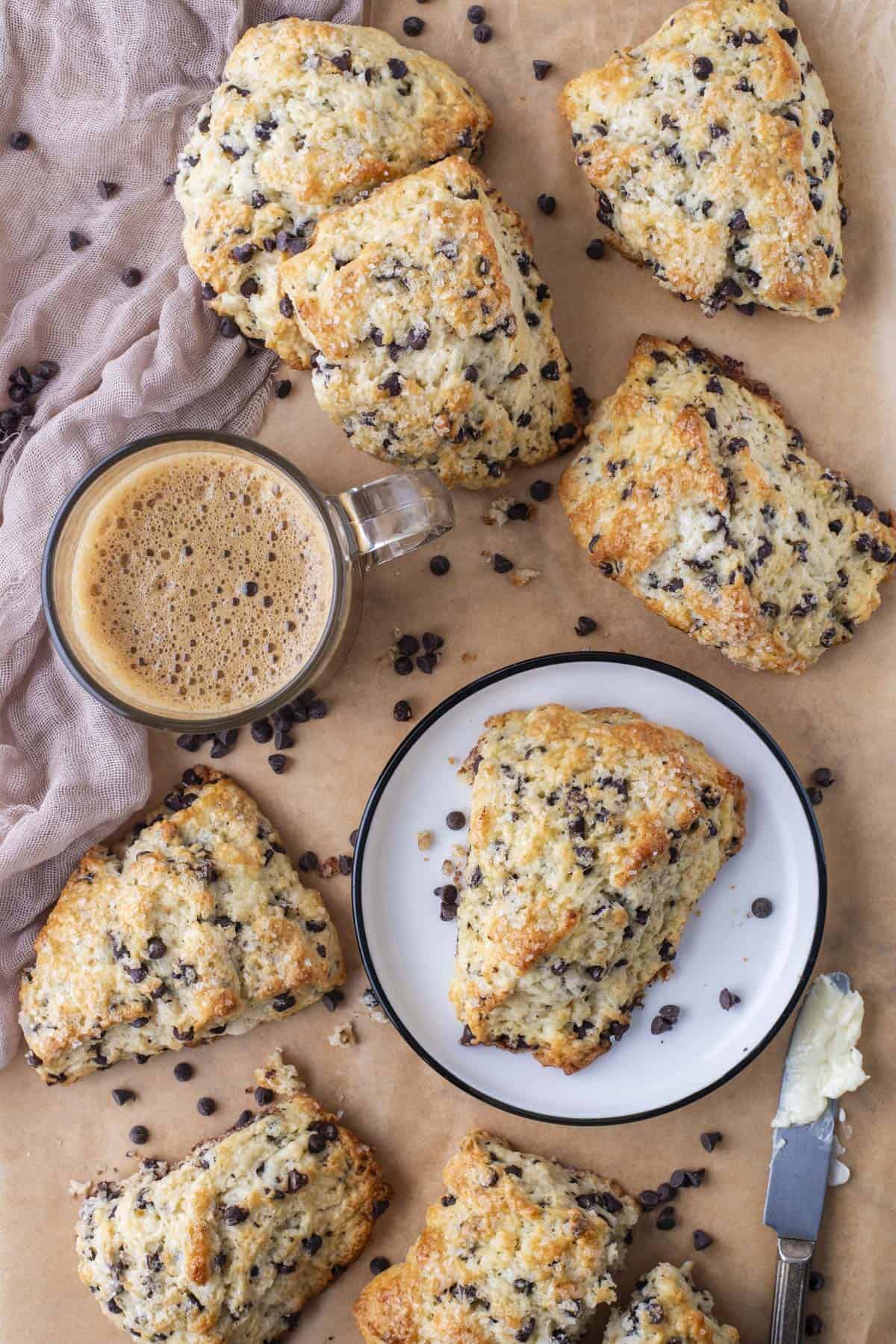 chocolate chip scones arranged on brown parchment paper 
