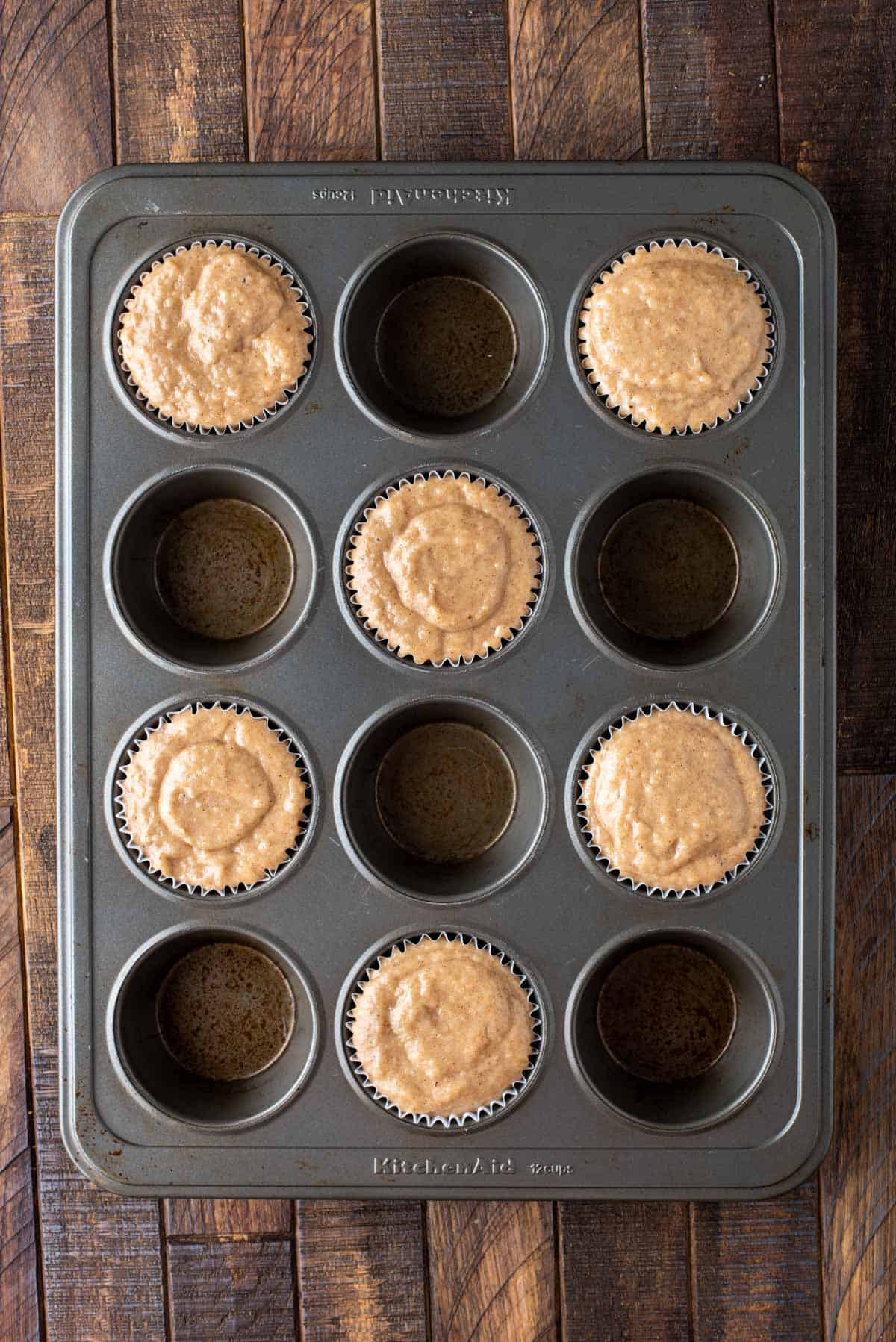 metal muffin pan filled with muffin batter