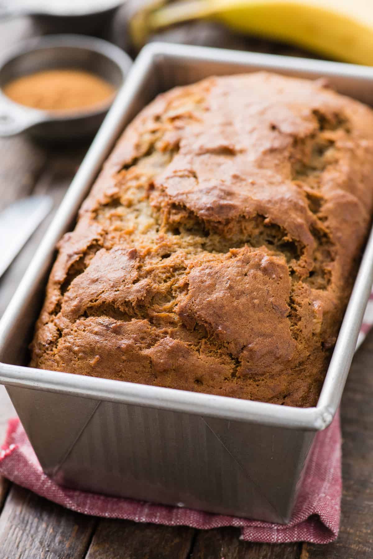 whole loaf of banana bread in metal loaf pan