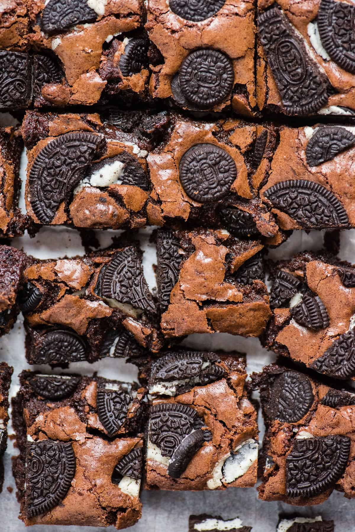 homemade brownies with oreo cookie pieces baked on top cut into squares