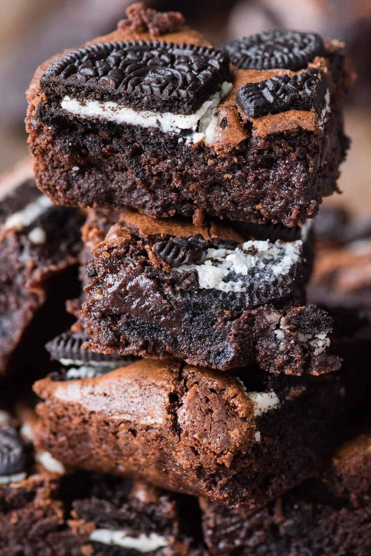 4 oreo brownies cut into squares and stacked on top of each other