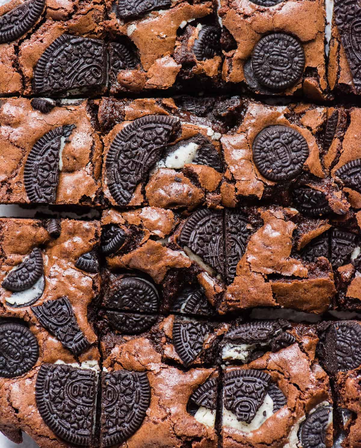 homemade brownies with oreo cookie pieces baked on top cut into squares