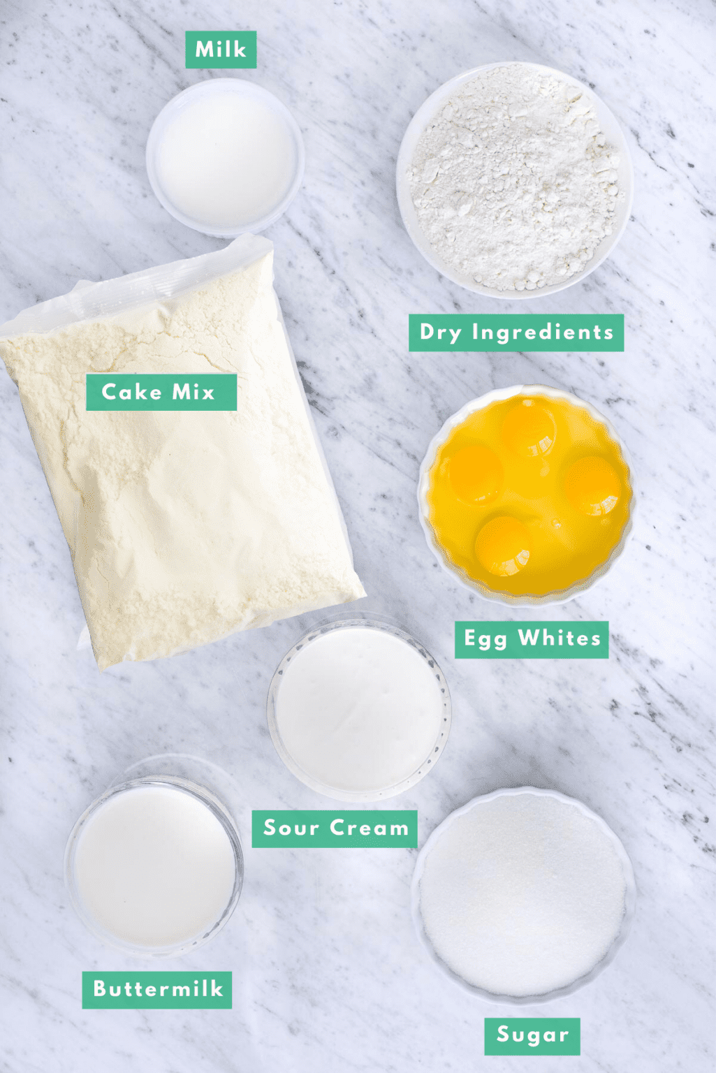 ingredients to make yellow cake from yellow cake mix on white background