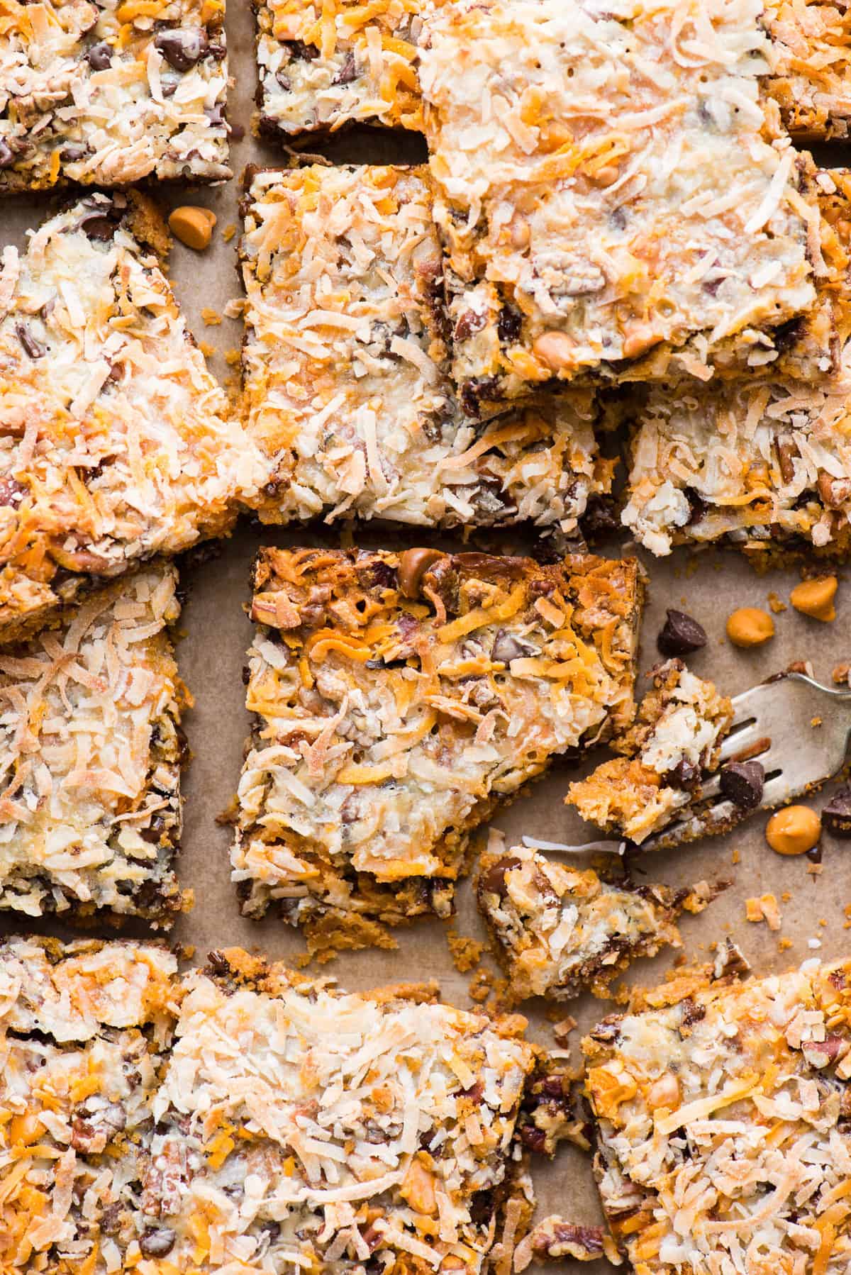 hello dolly bars cut into squares and arranged on a metal baking sheet