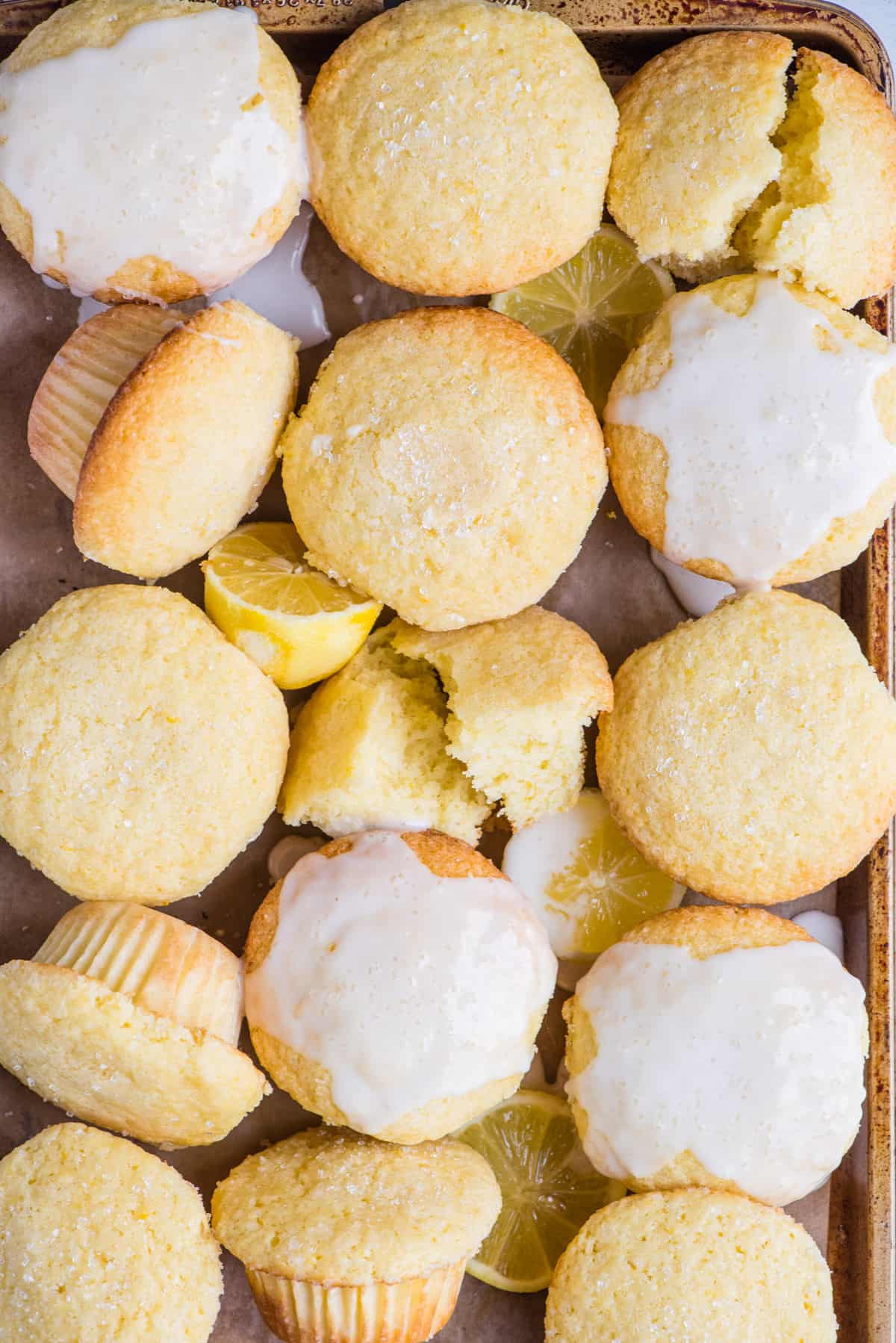 lemon muffins arranged in a grid on a metal baking sheet