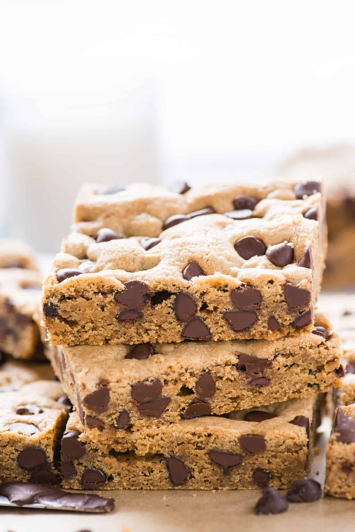 3 chocolate chip cookie bars cut into squares stacked on top of each other