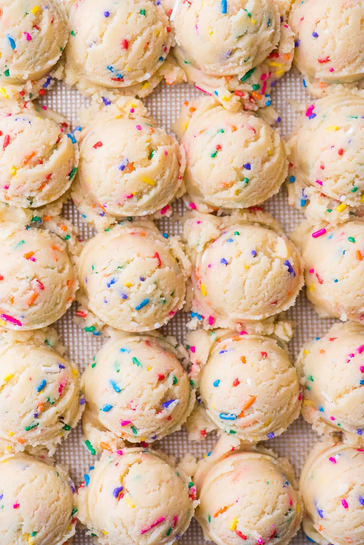 funfetti cookie dough balls arranged in a grid pattern