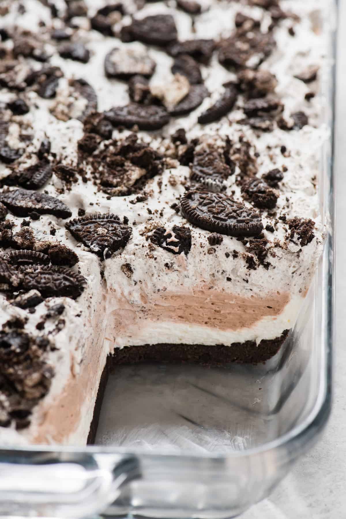 slice of oreo dessert removed from glass 9x13 inch pan
