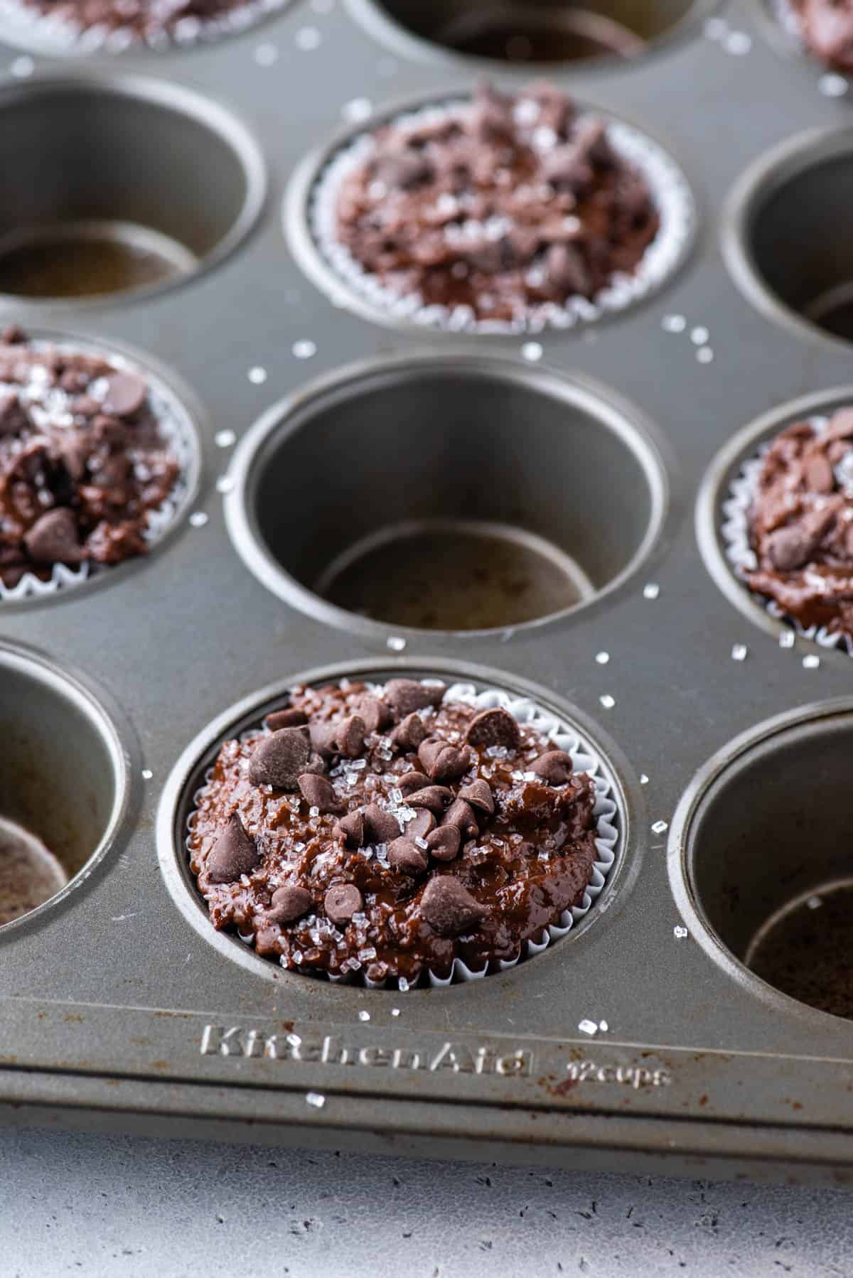 chocolate muffin batter in muffin pan