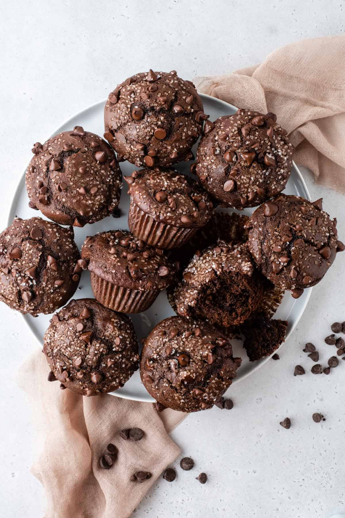 chocolate muffins arranged on white serving tray