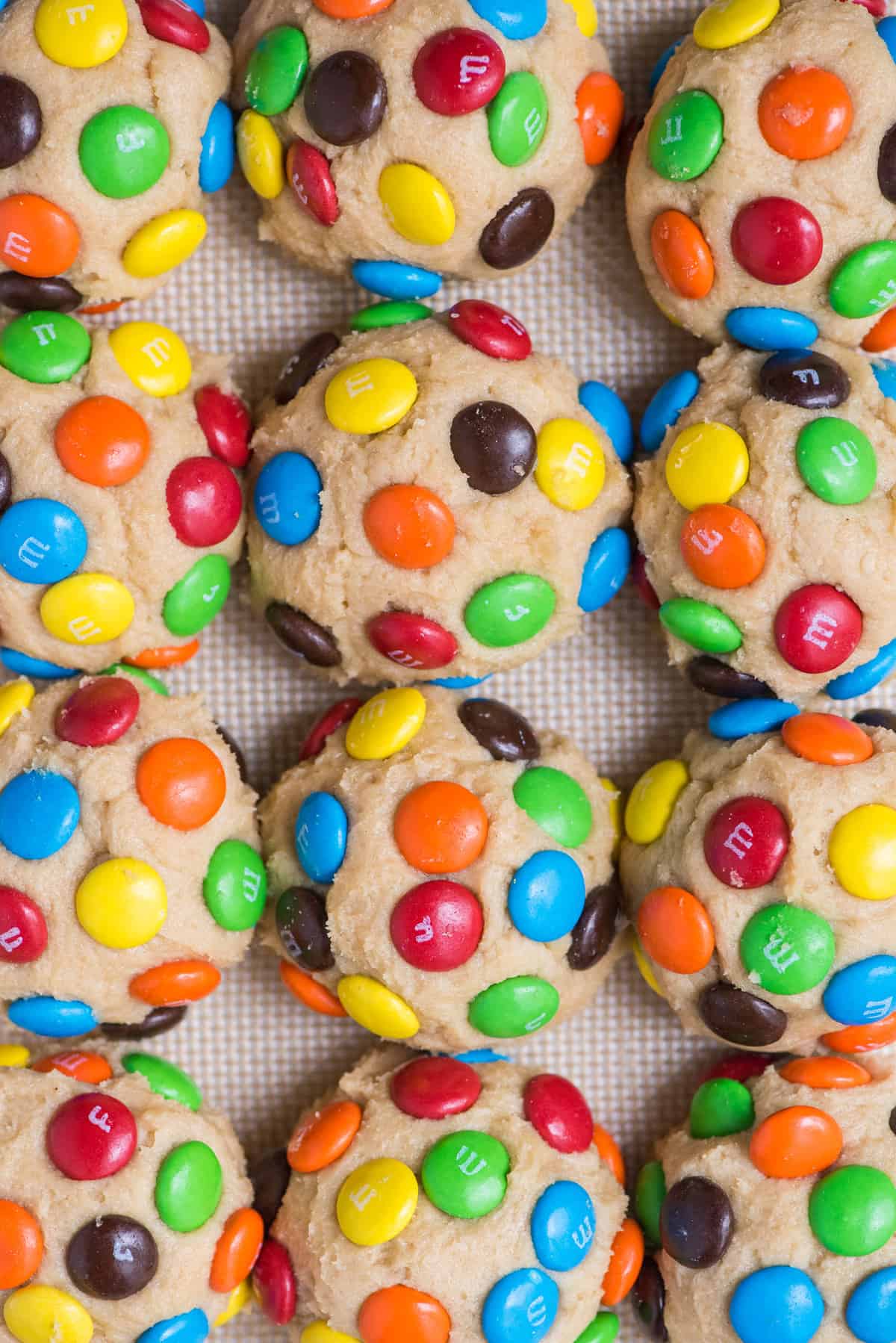 M&M cookie dough balls arranged in a grid pattern
