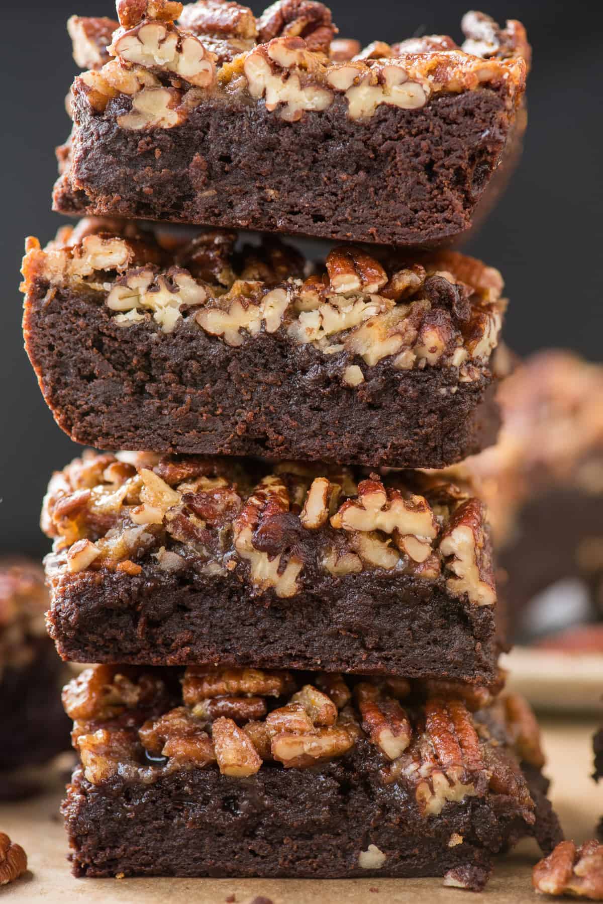 close up of pecan pie brownies stacked on top of each other