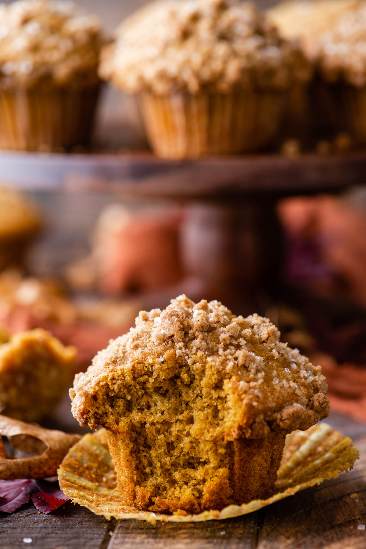 muffin with bite removed on wood background