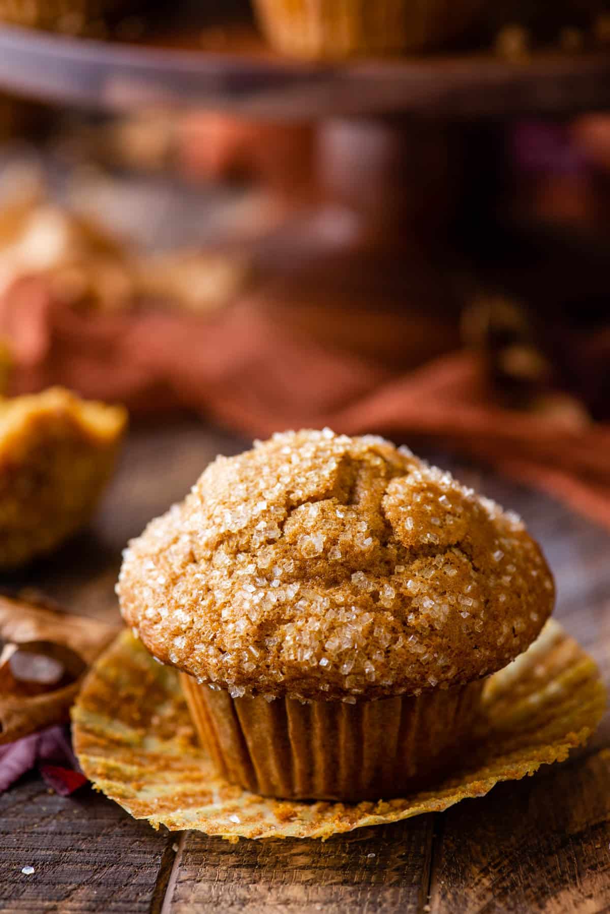 single pumpkin muffin on wood background