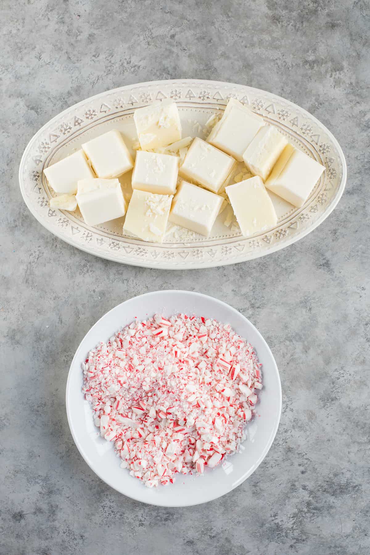 ingredients to make white peppermint bark on white platters