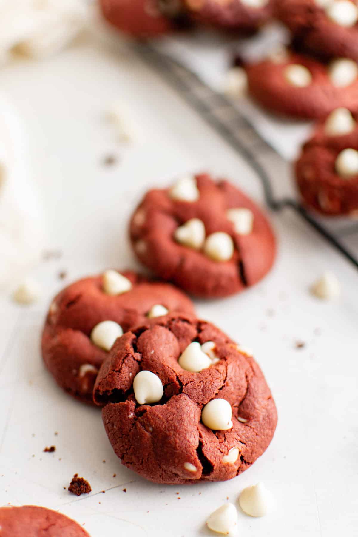 red velvet cookies with white chocolate chips on white background