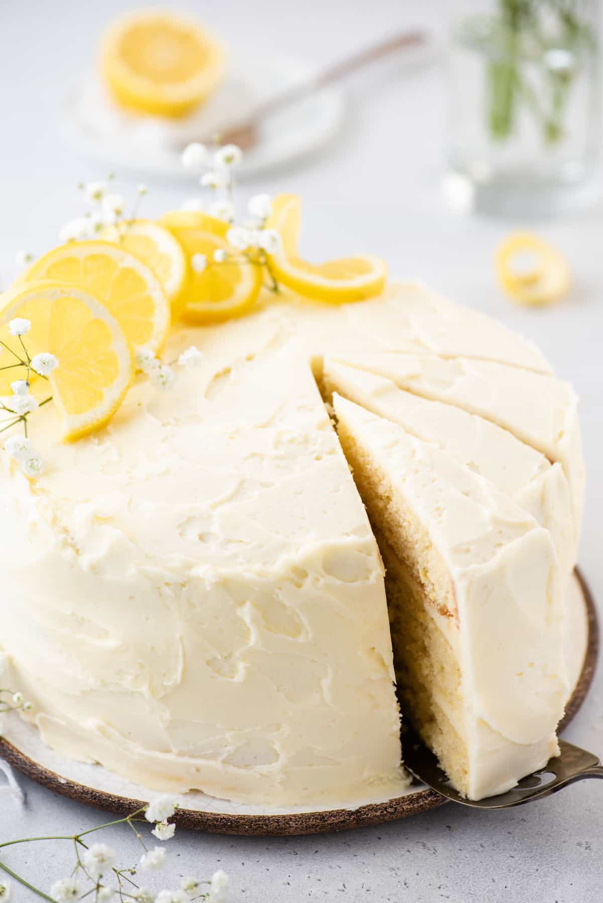Pulling out a slice of lemon layer cake
