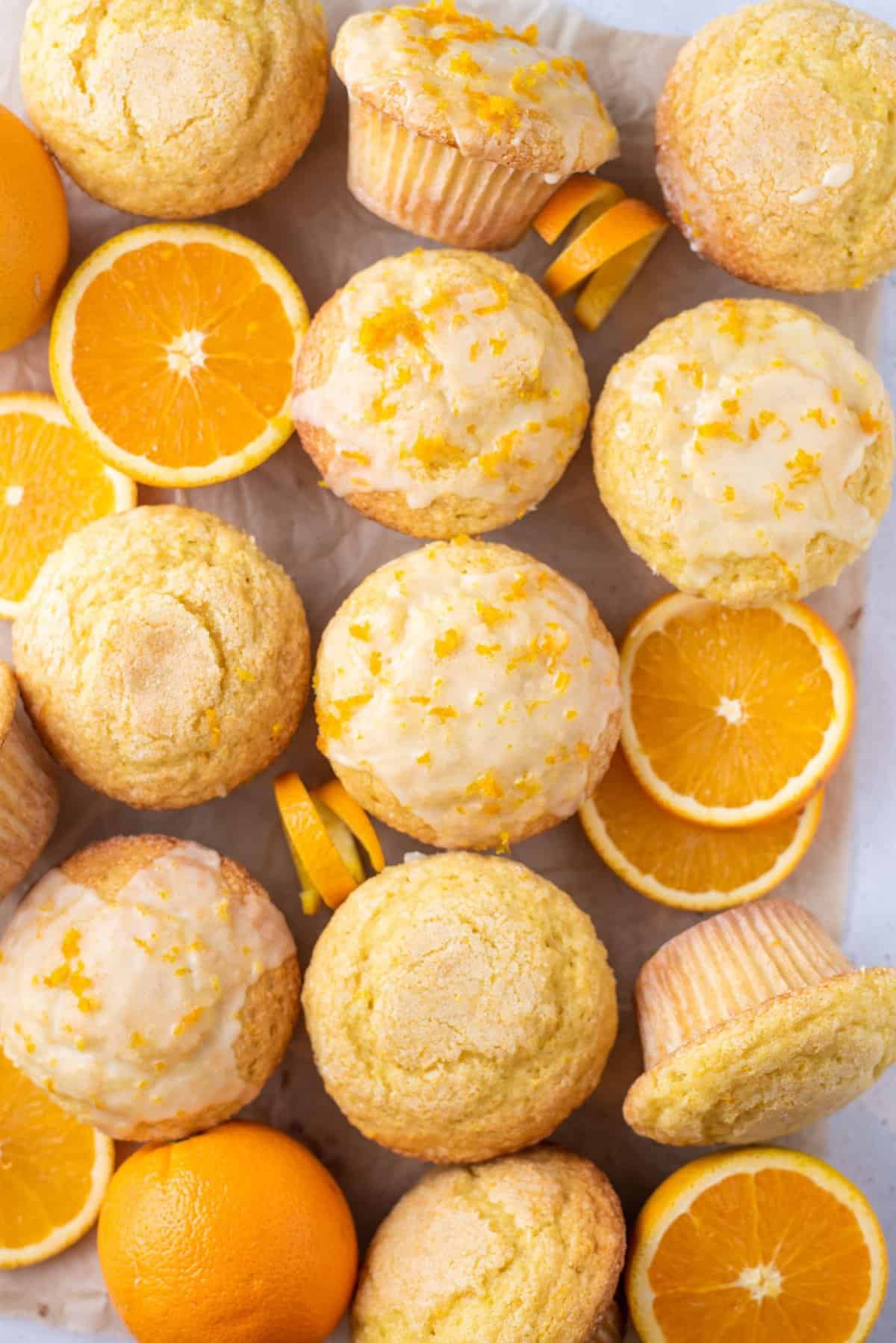 orange muffins arranged in a grid pattern with orange slices
