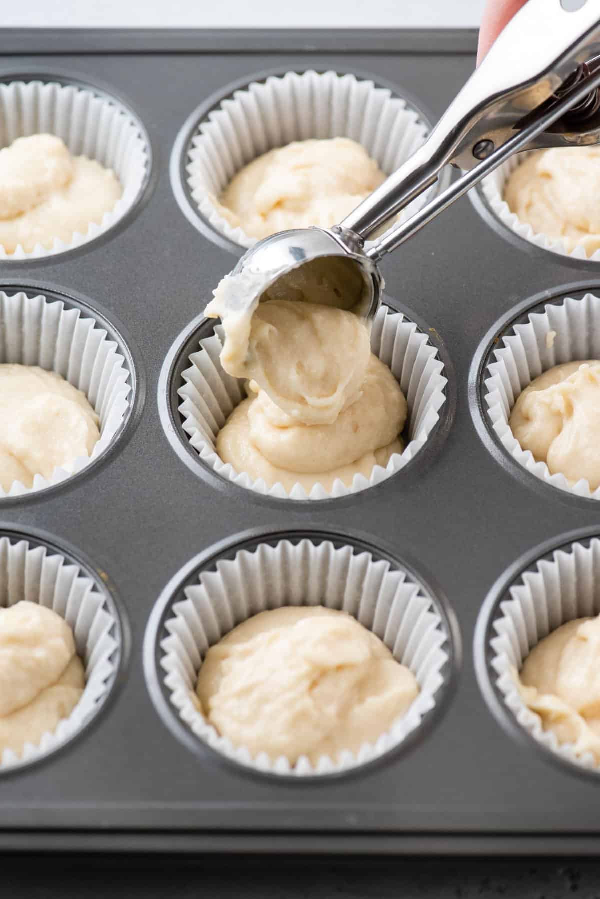 Portioning cupcake batter into liners