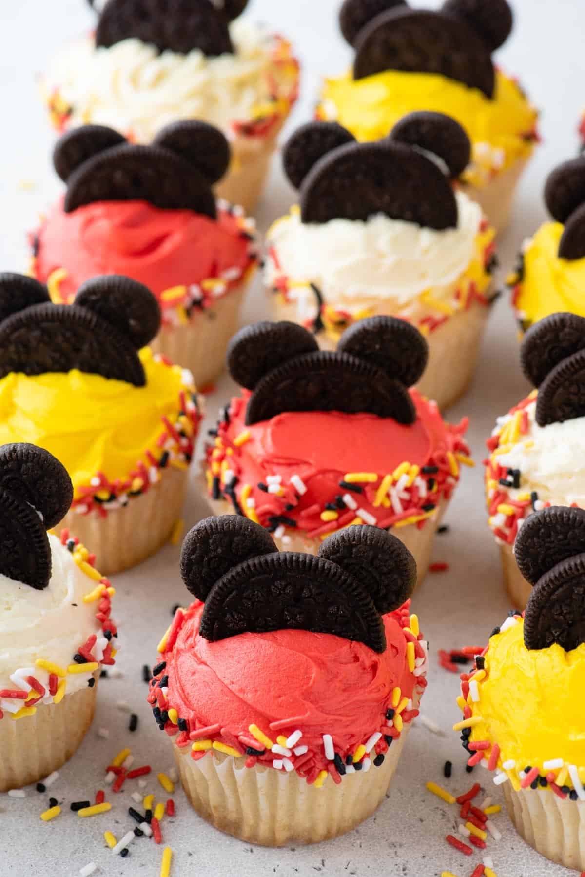 Mickey Mouse cupcakes lined up on table