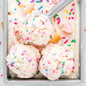 Overhead view of birthday cake ice cream scoops in loaf pan