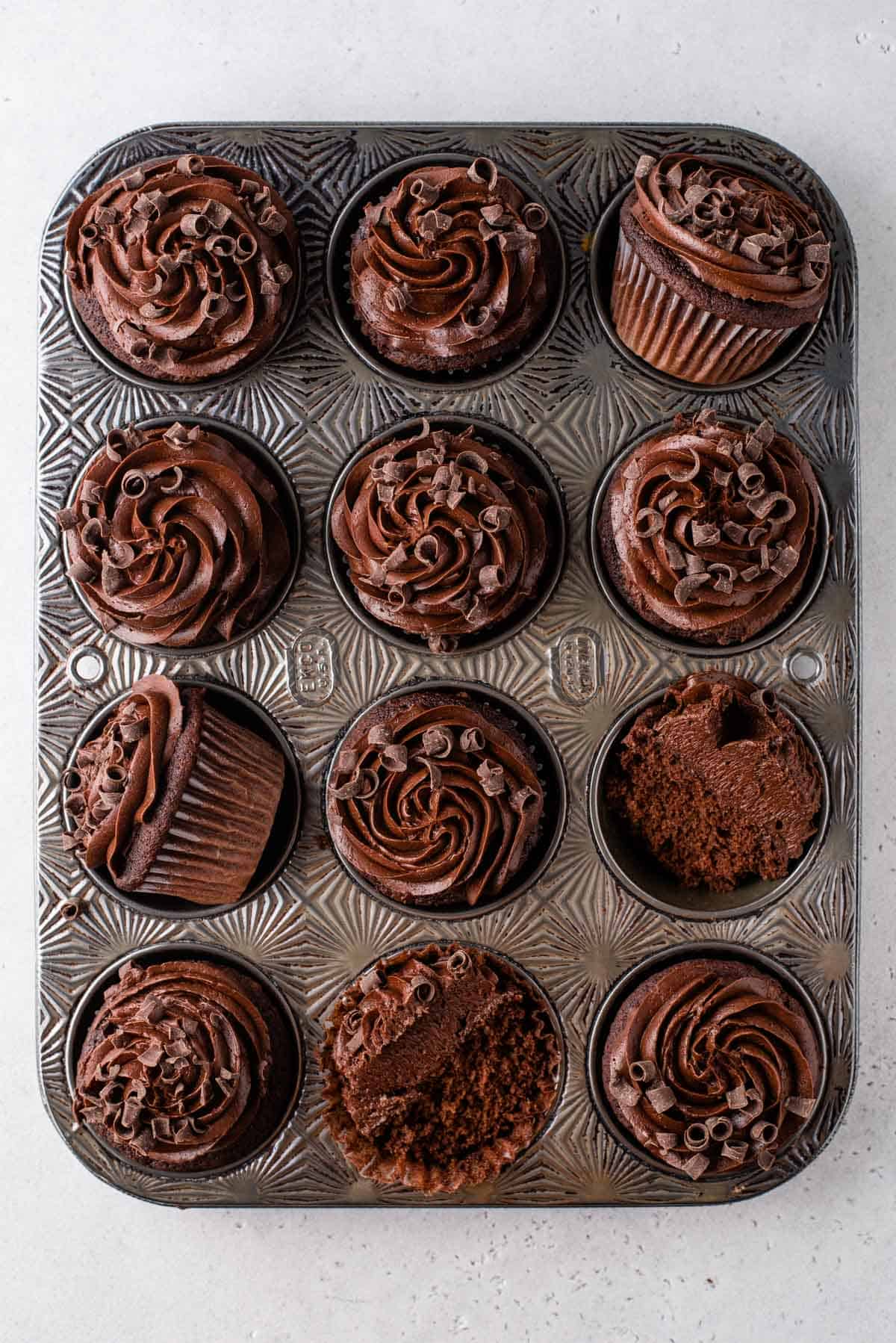 Frosted gluten-free chocolate cupcakes in muffin tin