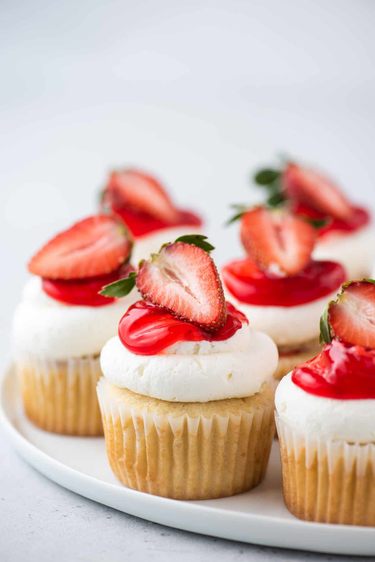 Strawberry shortcake cupcakes on round platter