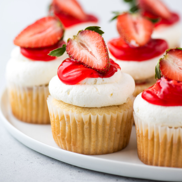 Closeup of strawberry shortcake cupcakes on platter