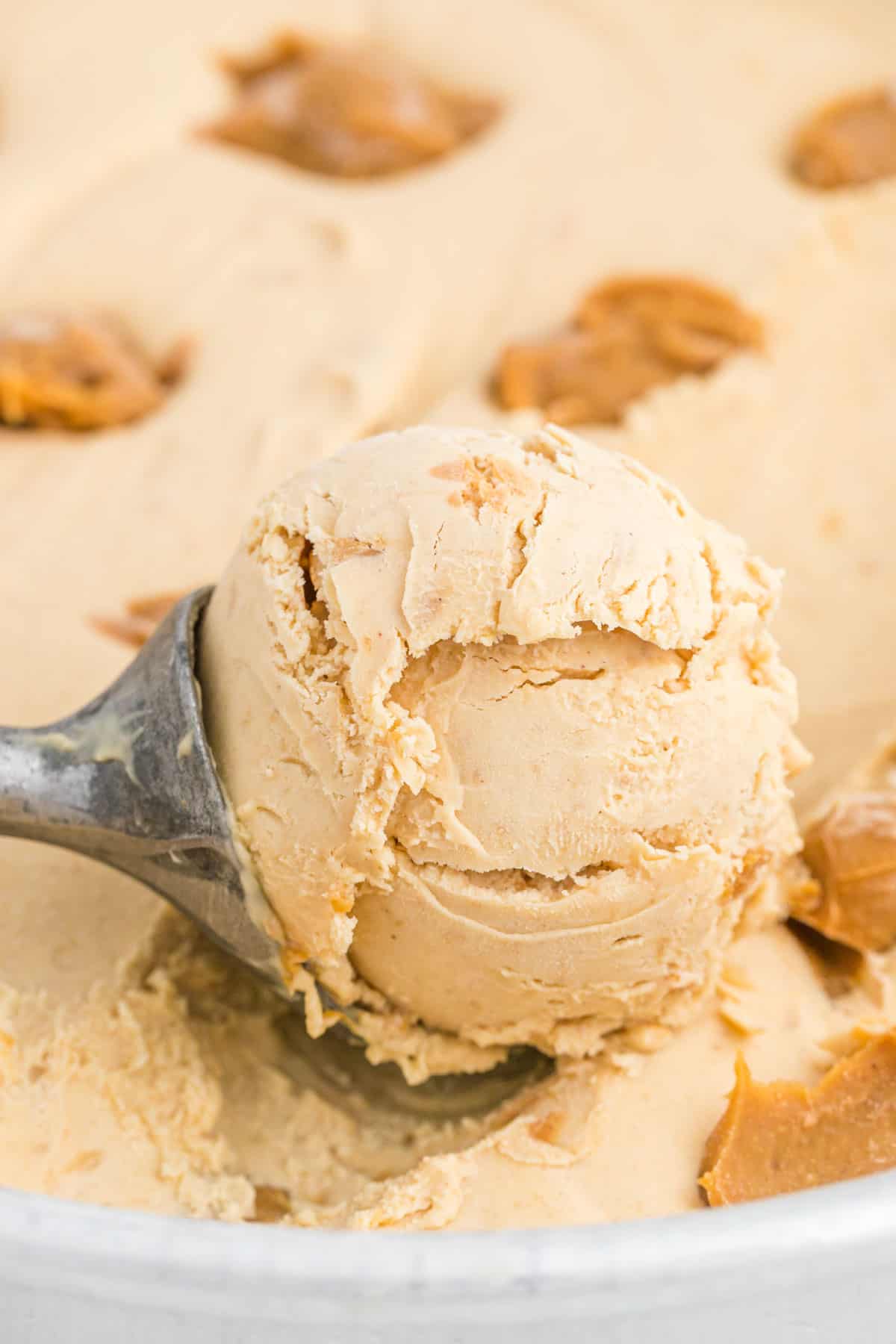 Scoop of peanut butter ice cream in pan