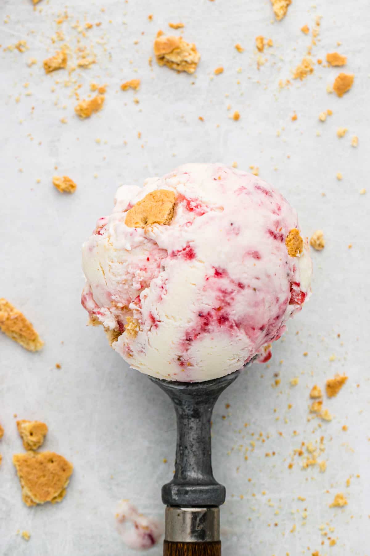 scoop of strawberry cheesecake ice cream in ice cream scoop