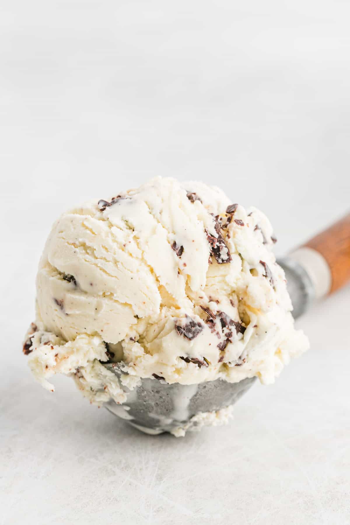 chocolate chip ice cream in a metal ice cream scoop