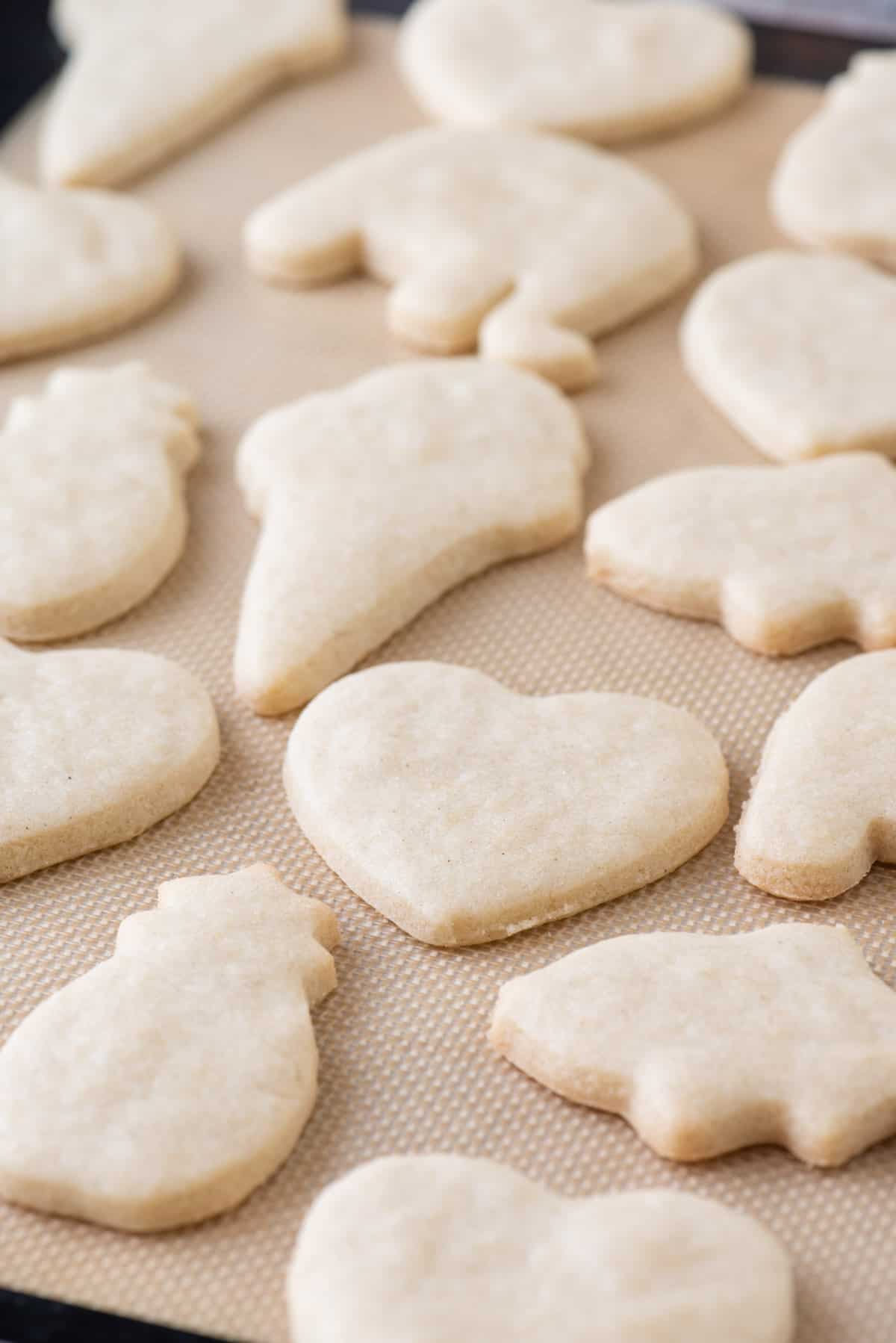 Gluten-free sugar cookies on silpat-lined baking sheet