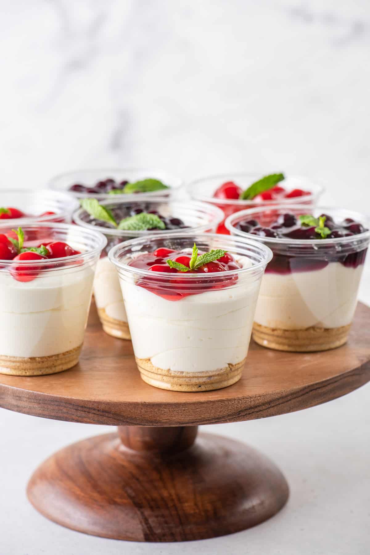 No bake cheesecake cups on a pie stand