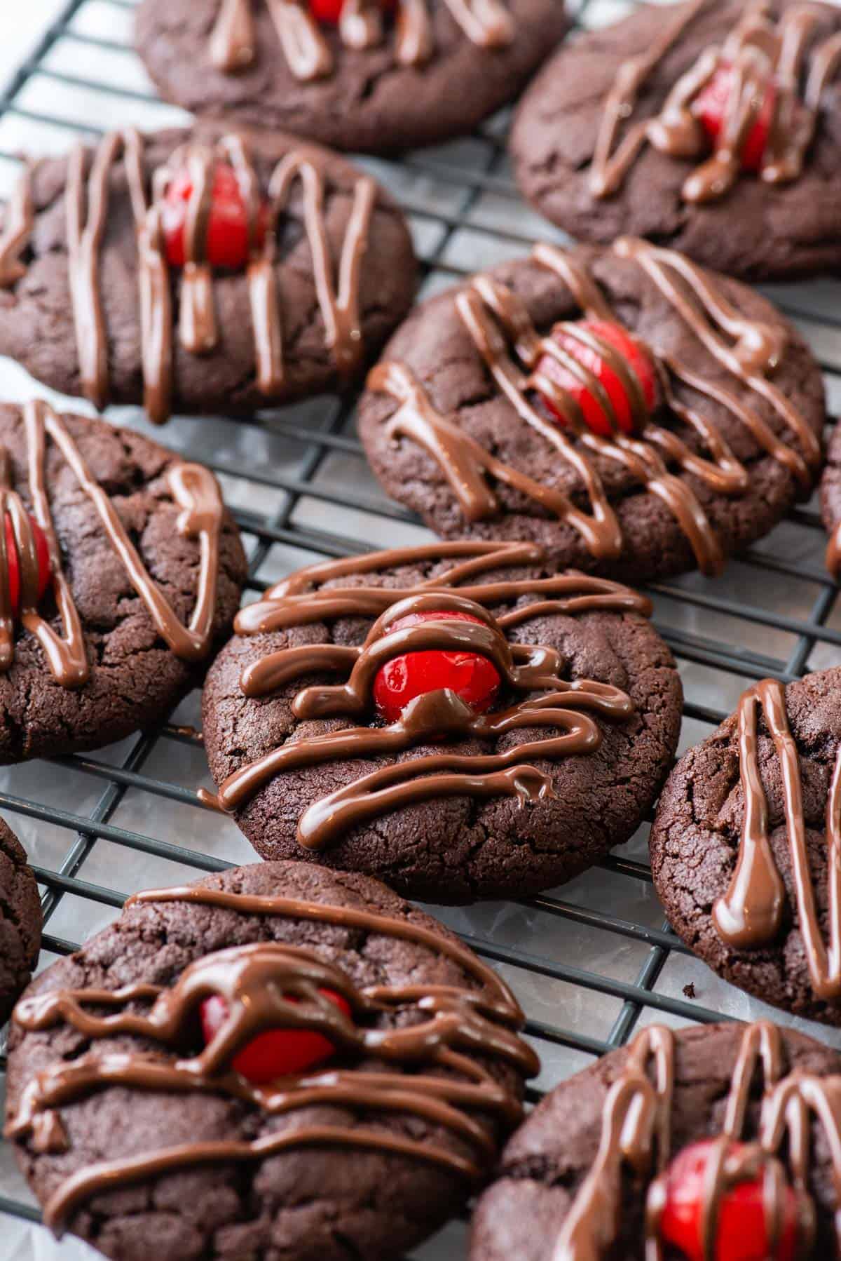Chocolate covered cherry cookies on a baking sheet