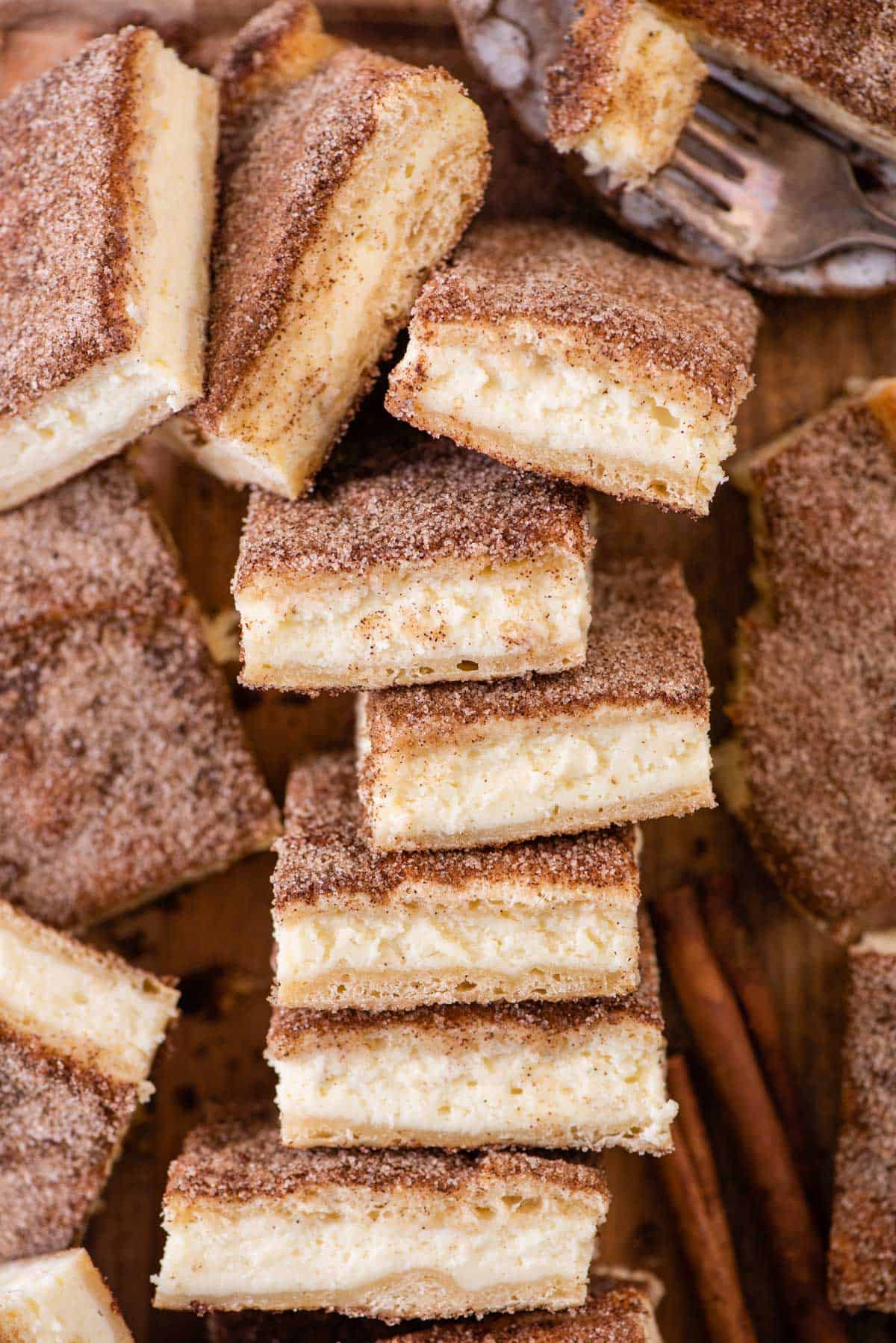 Overhead view of churro cheesecake bars on their side