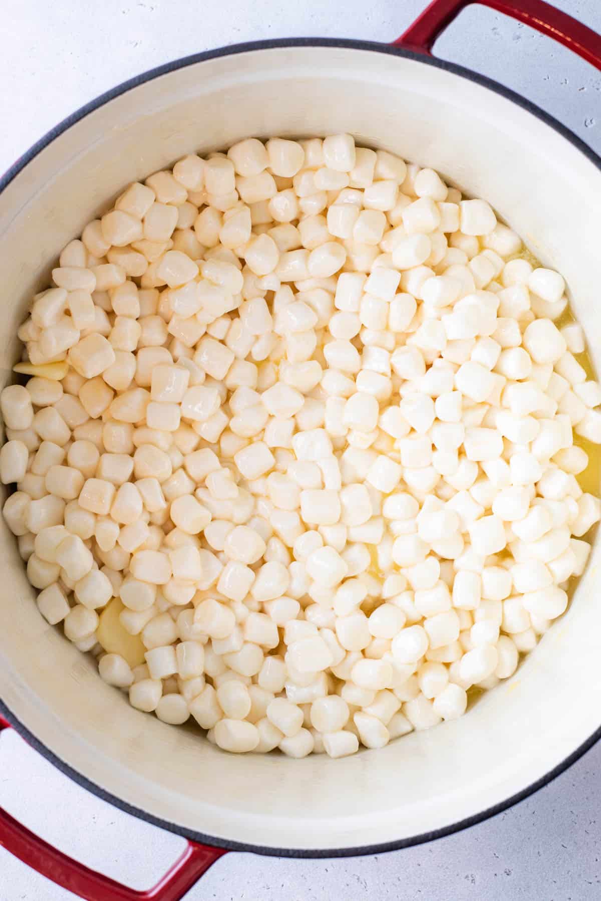 Mini marshmallows and butter in a pot