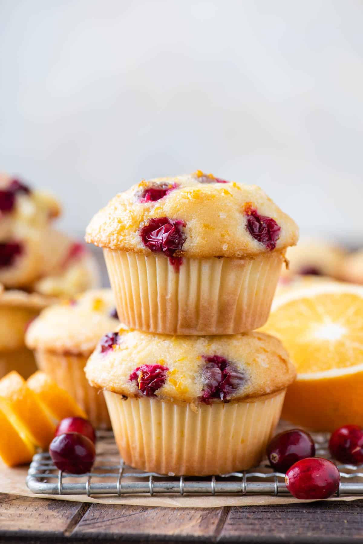 Two orange cranberry muffins stacked on each other