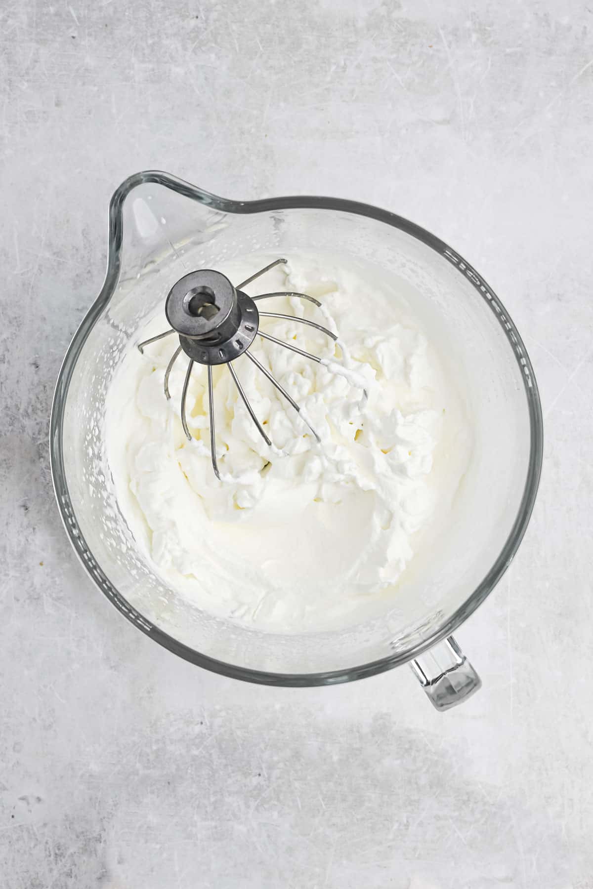 Heavy whipping cream in a mixing bowl