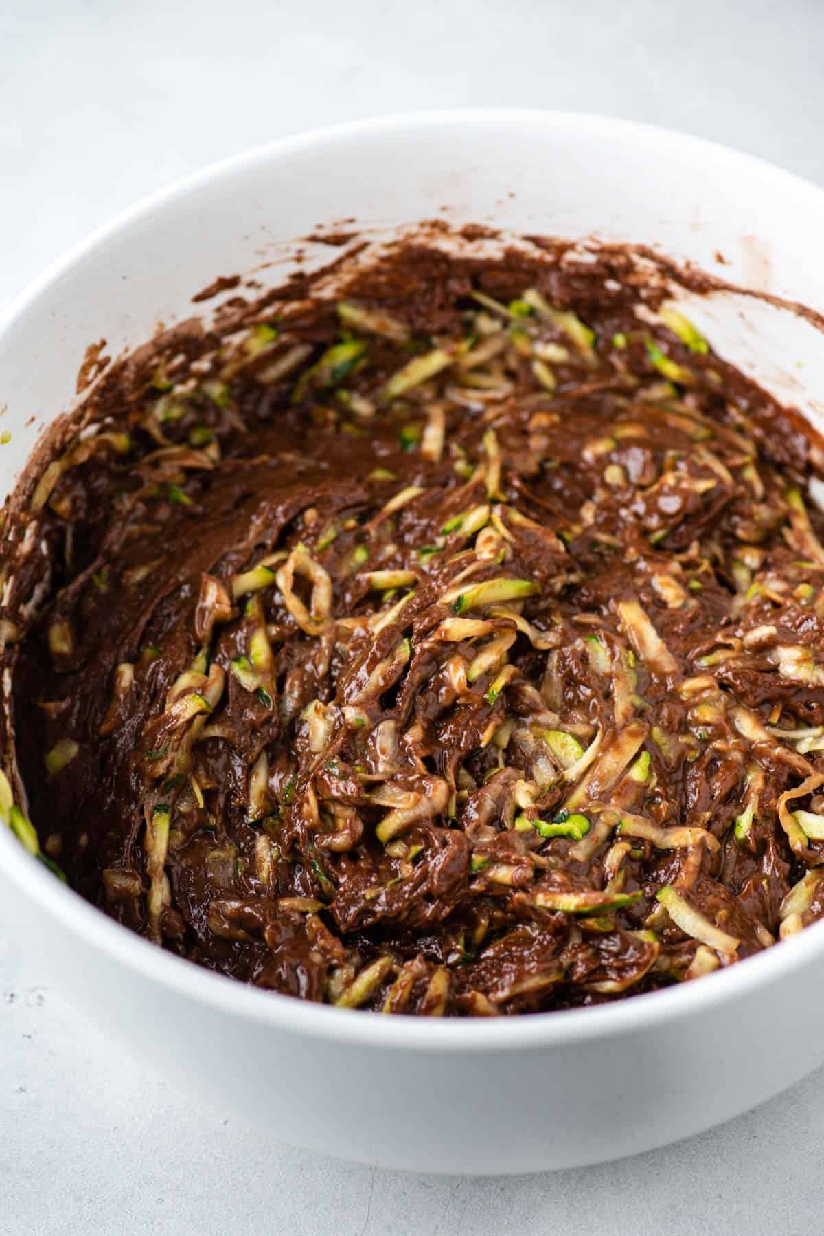 Shredded zucchini mixed in with chocolate muffin batter