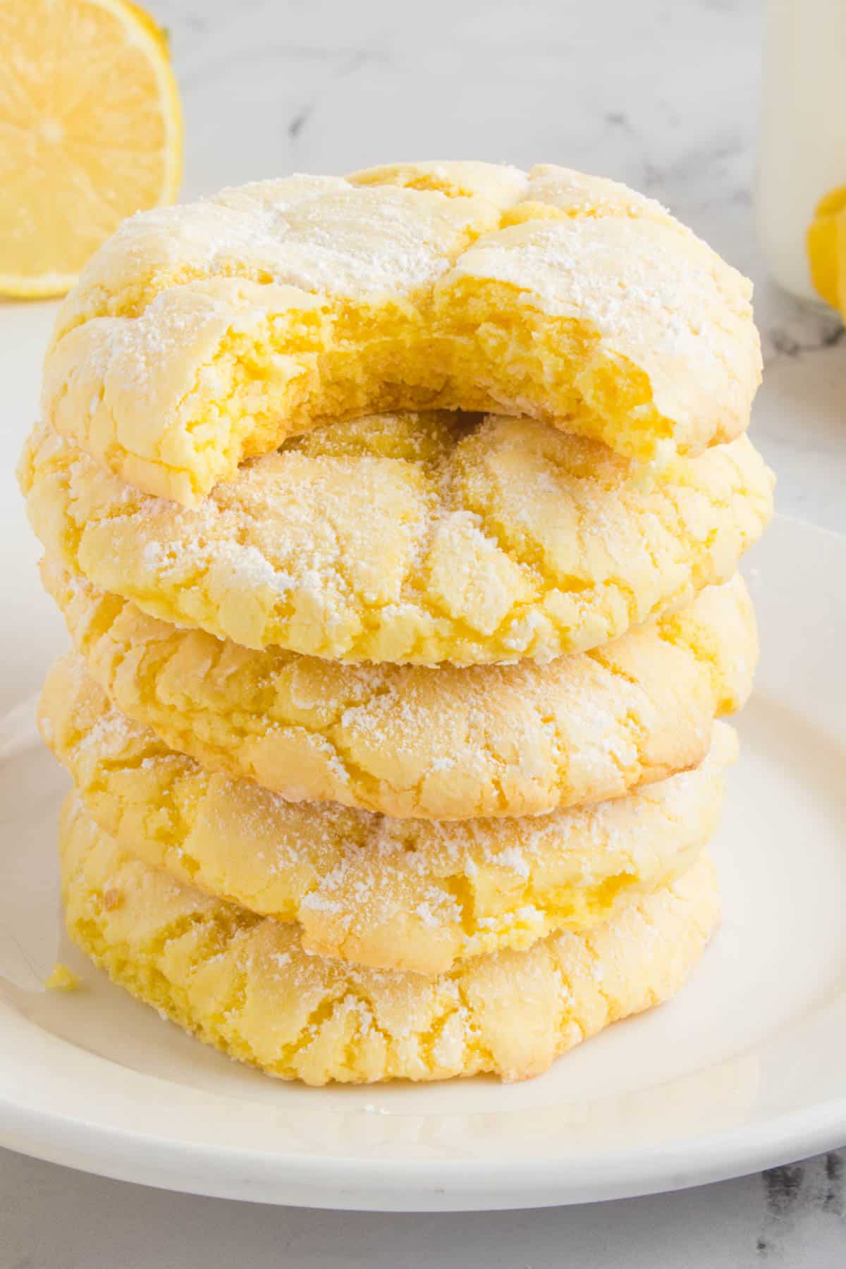 stack of lemon cake mix cookies sitting on a white plate