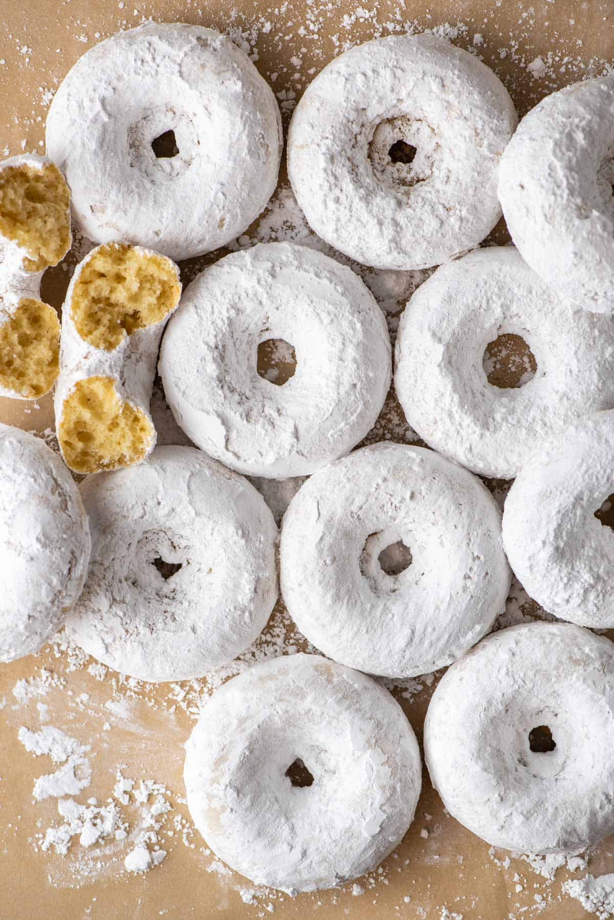 powdered sugar donuts arranged in pattern